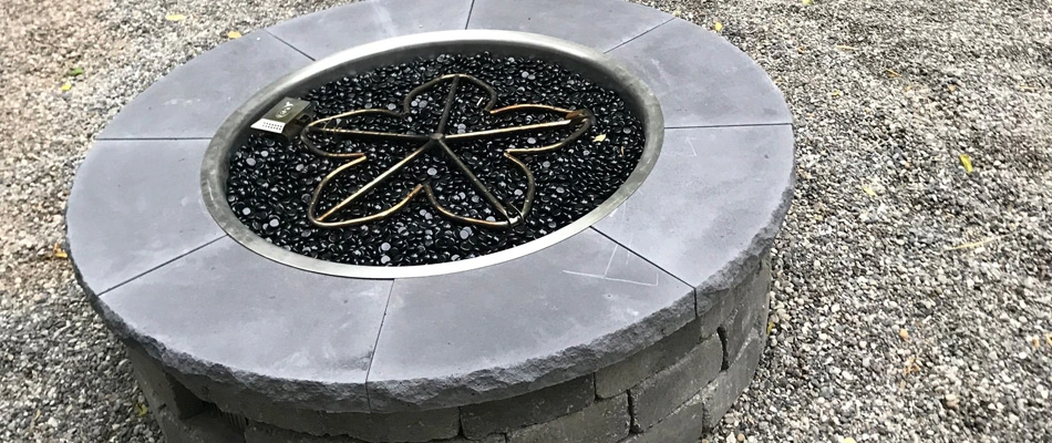 Gas fired pit installed over property in Adel, IA.